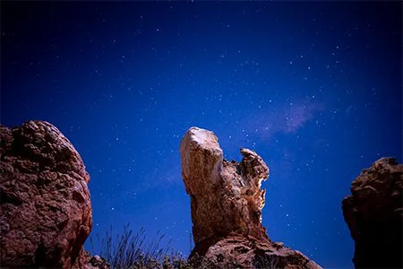 A dense Cederberg star field framed by monumental rock formations