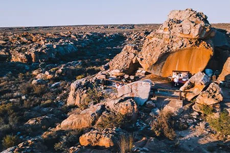 A secluded open-air Star Suite nestled among sandstone formations